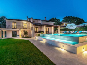 villa with swimming pool and outdoor kitchen